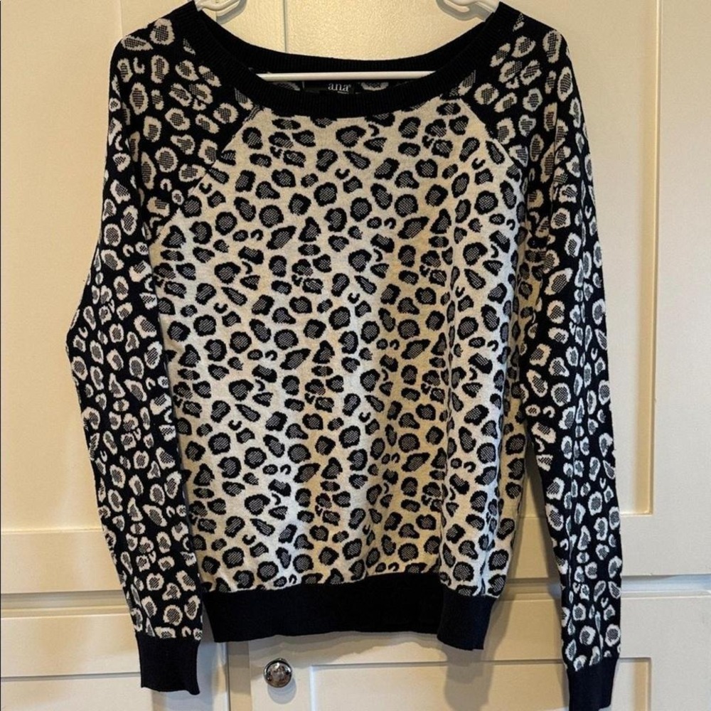 Women's size medium, black and white animal print sweater.